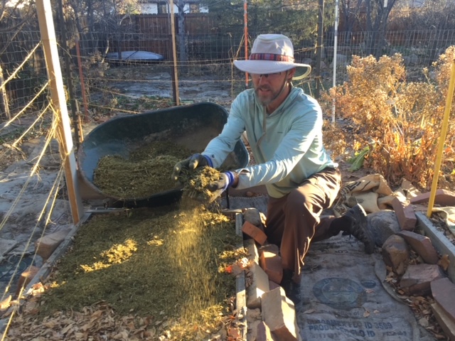 Applying hemp garden mulch.